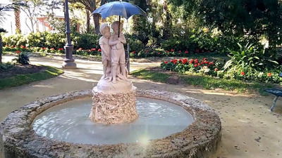 Statue of children under an umbrella in Genovés Park in Cadiz