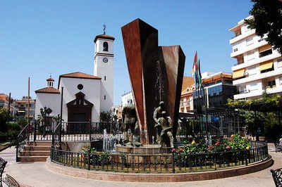 Constitution Square in the old centre of Fuengirola with a church and fountain