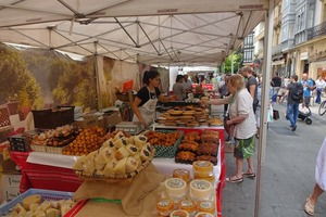 A stall selling cheese and smoked meats at the Friday street market in Valencia