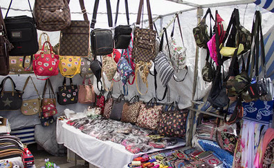 Street markets in Málaga on Wednesdays — stalls with bags and souvenirs