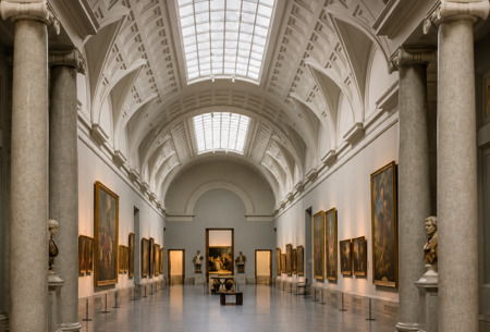 Gallery at the Prado Museum with paintings and classical architecture